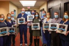 Clinical leaders with CareChex award plaques