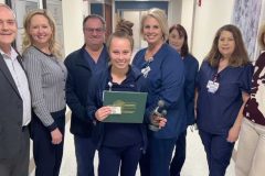 daisy award winner samantha childress with her award and hamilton leadership