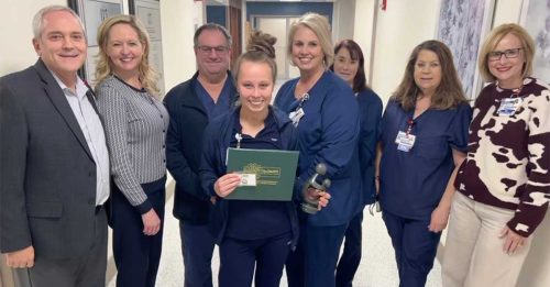 daisy award winner samantha childress with her award and hamilton leadership