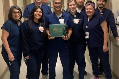 Photo: Jose Brillo, RN, recently received the DAISY Award at Hamilton Medical Center (HMC). Brillo is pictured (center) with additional department associates and leaders.