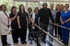 Hiram “Gene” Stevens is pictured (fifth from right) with some of the Quinton staff members who helped take care of him.